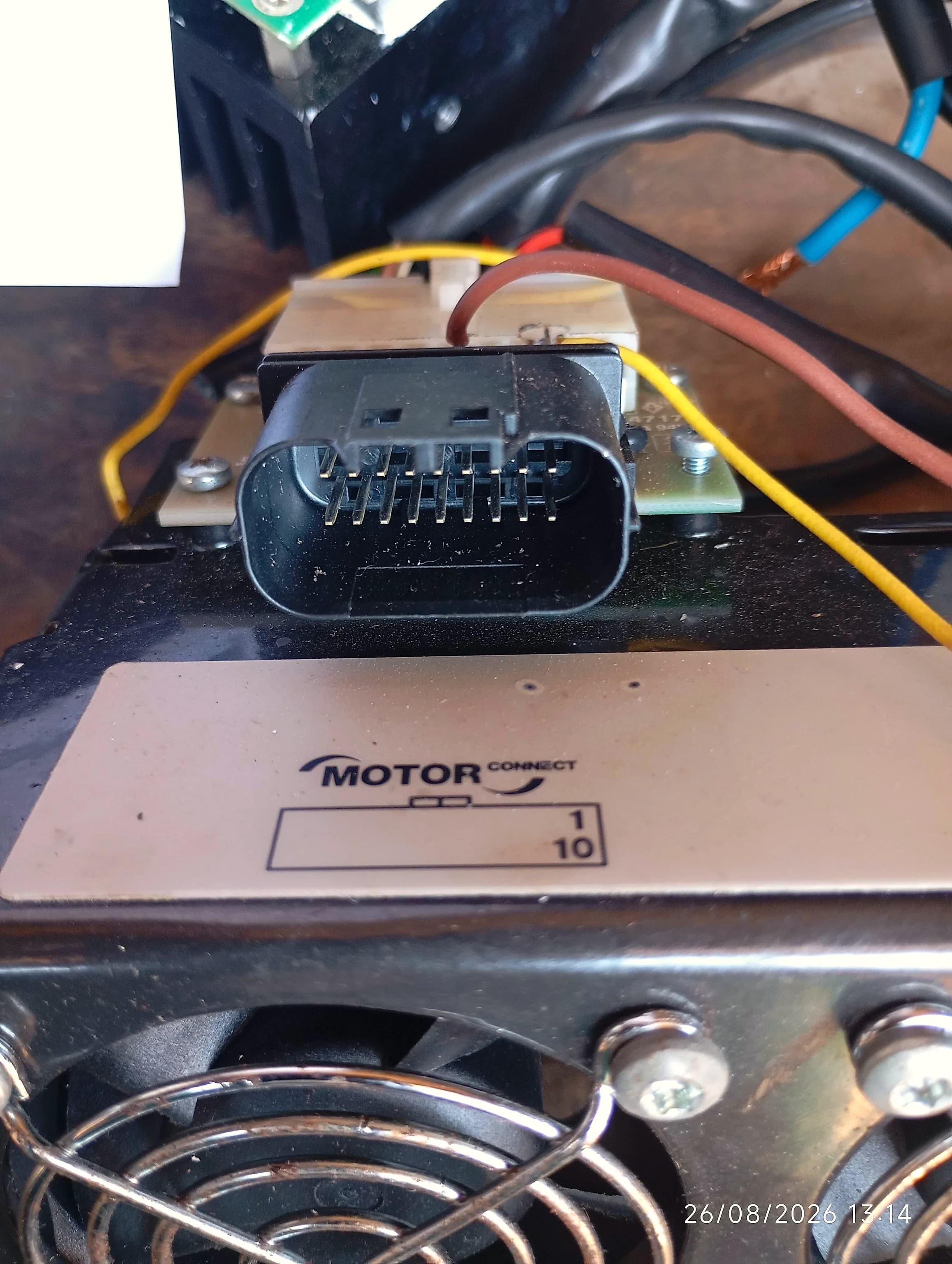 Genverter Motor Connect board with a ten-pin loom connector, opened on the workshop bench