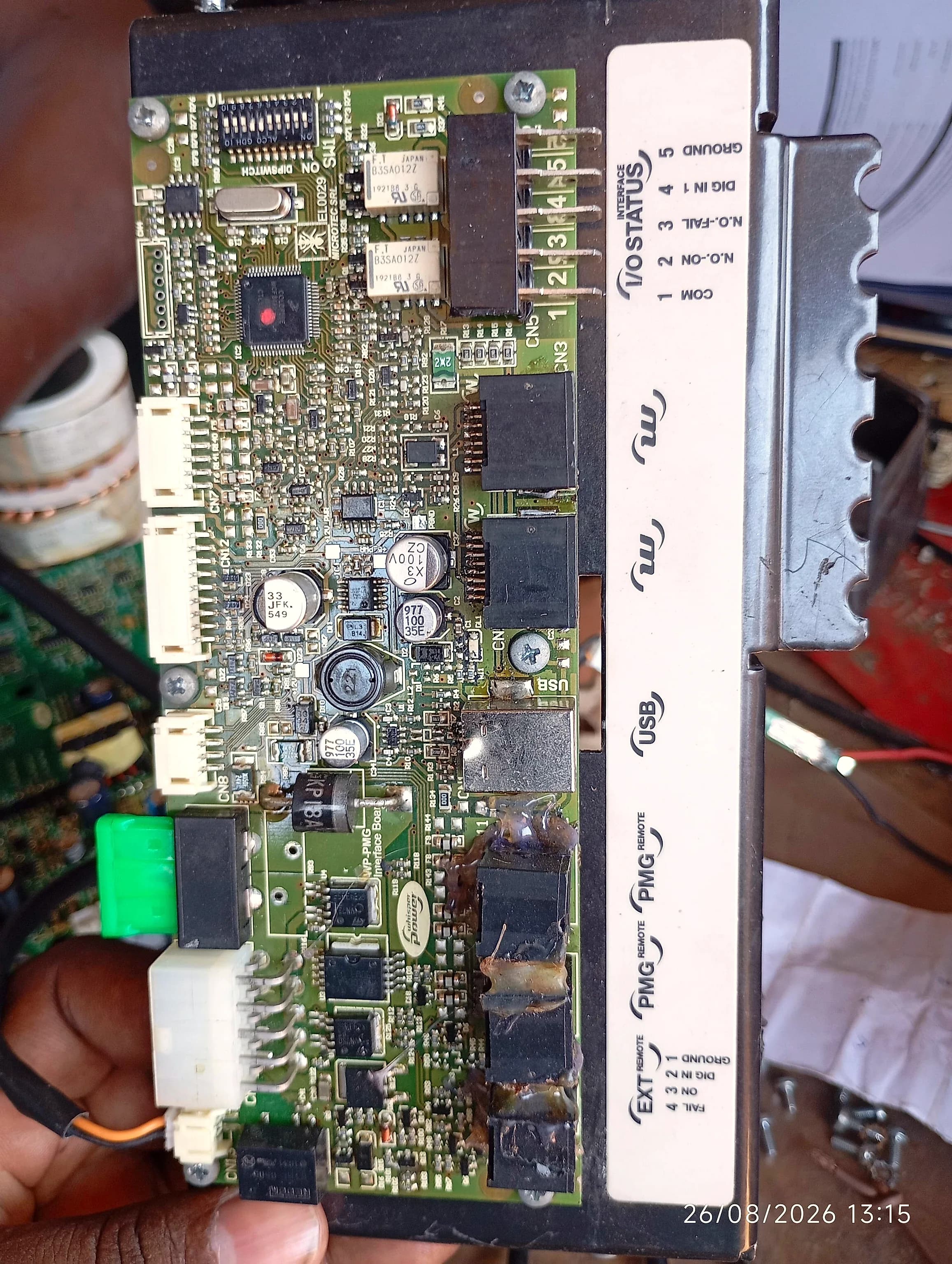 WhisperPower WP-PMG interface board showing heat damage and charring around the output components
