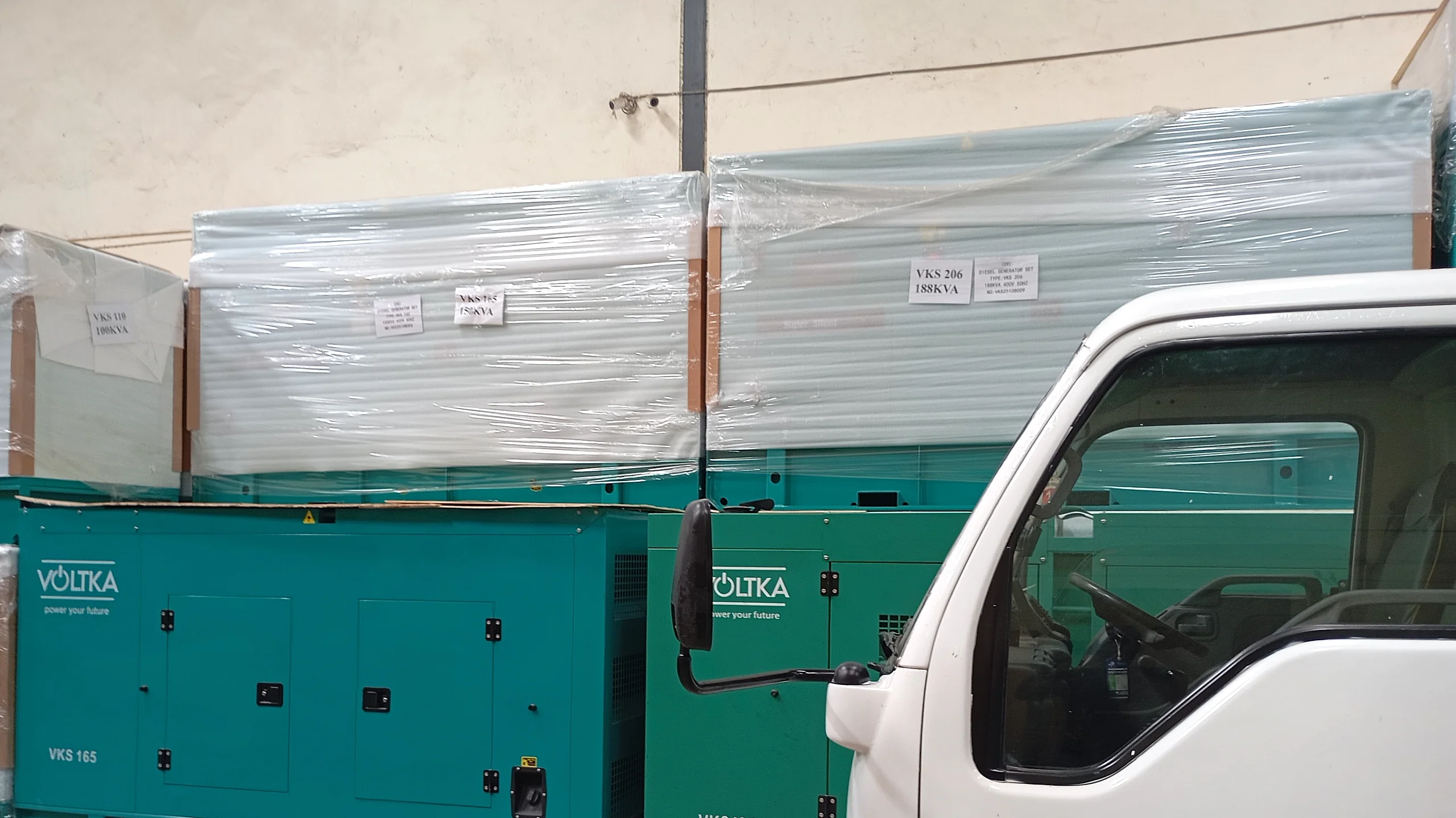 VOLTKA VKS 165 and VKS 188 generators staged for delivery beside the truck at EmersonEIMS