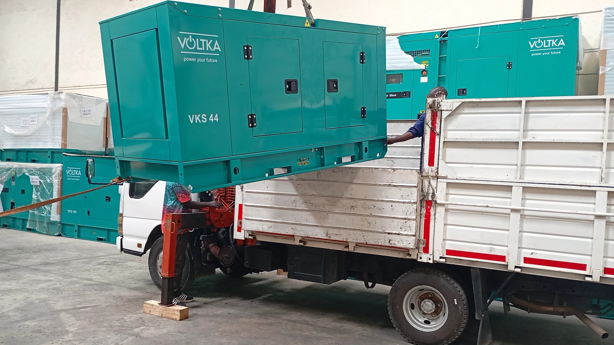 VOLTKA Cummins VKS 44 generator crane-loaded onto a delivery truck at EmersonEIMS Nairobi warehouse