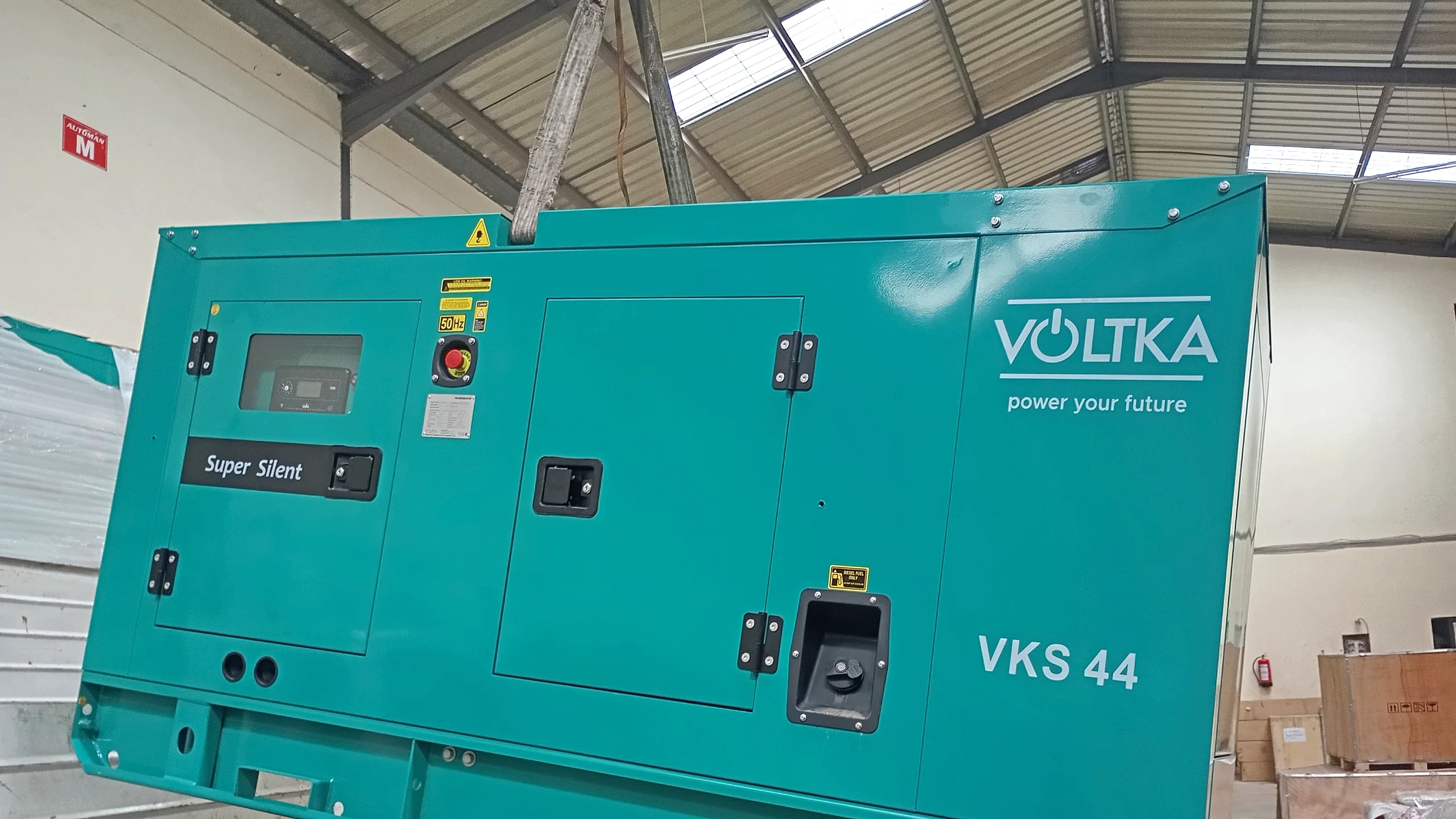 VOLTKA Cummins VKS 44 super silent generator side profile with VOLTKA branding at EmersonEIMS Nairobi warehouse
